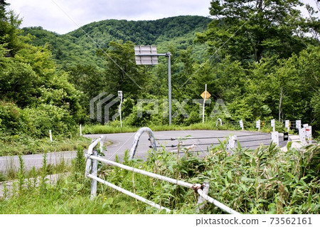 Mountain road curves and guardrails Mountain road curves and guardrails 73562161