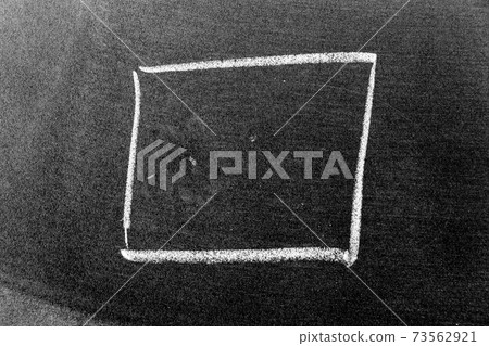White chalk hand drawing in square or banner shape on black board background White chalk hand drawing in square or banner shape on black board background 73562921