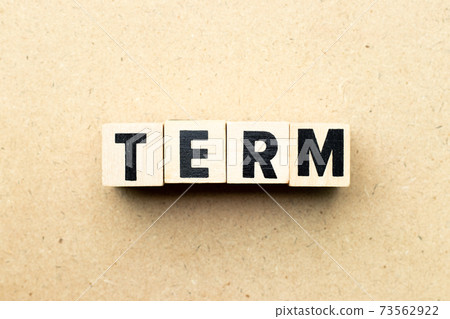 Alphabet letter block in word term on wood background Alphabet letter block in word term on wood background 73562922