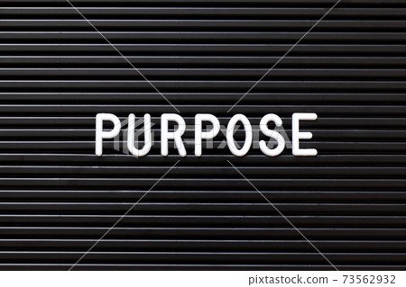 White alphabet in word purpose on black color felt letter board background 73562932