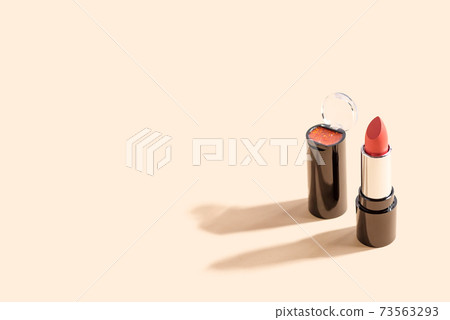 red lipstick on beige background with copy space. Fashion blog design. 73563293