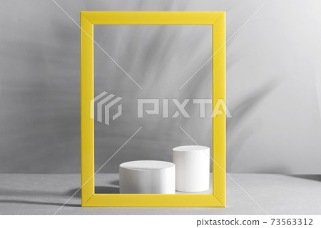 Geometric podium scene with yellow frame on paper ultimate gray background 73563312