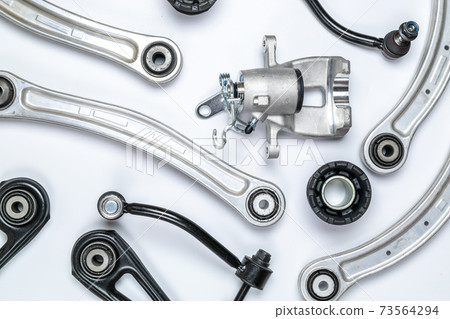 Engine gears. Auto motor mechanic spare or automotive piece on white background. Set of new metal car part. Flat lay, top view, copy space. Engine gears. Auto motor mechanic spare or automotive piece on white background. Set of new metal car part. Flat lay, top view, copy space. 73564294
