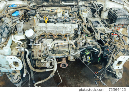 Close-up, internal combustion engine repair. Close-up, internal combustion engine repair. 73564423