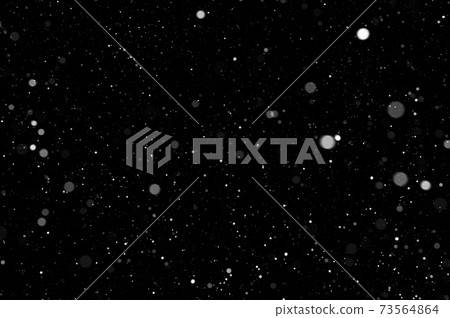 Bokeh of white snow on a black background. Snowfall - design element. 73564864