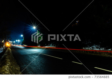 Magnificent shake the light of car lights in the evening on the highway with the stars of streetlights Magnificent shake the light of car lights in the evening on the highway with the stars of streetlights 73564885