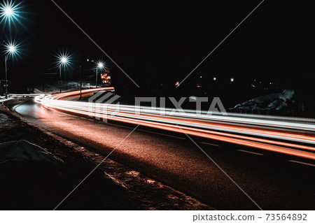 Magnificent shake the light of car lights in the evening on the highway with the stars of streetlights 73564892