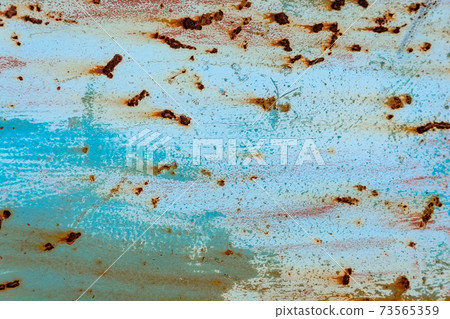 The blue metallic texture is covered with rust The blue metallic texture is covered with rust 73565359