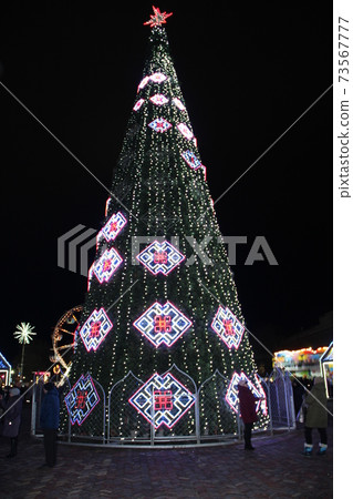 Christmas Tree in city area. sparkling and fabulous fairy New Year tree Christmas Tree in city area. sparkling and fabulous fairy New Year tree 73567777
