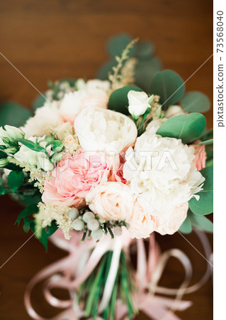 Wonderful luxury wedding bouquet of different flowers 73568040