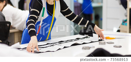 Image of designer hands working in workshop Image of designer hands working in workshop 73568913