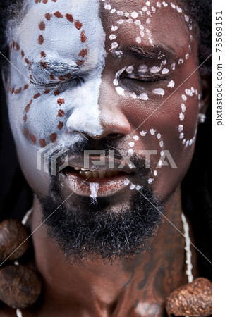 young african male feeling pain, stand with closed eyes 73569151