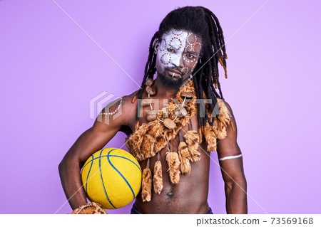 mysterious african male in national wear is going to play basketball mysterious african male in national wear is going to play basketball 73569168