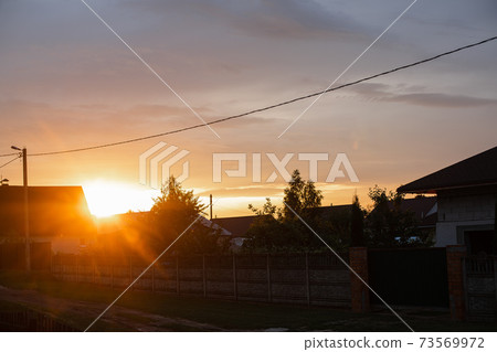 Sunset in countryside. Bright sunlight of the Sunset in countryside. Bright sunlight of the 73569972