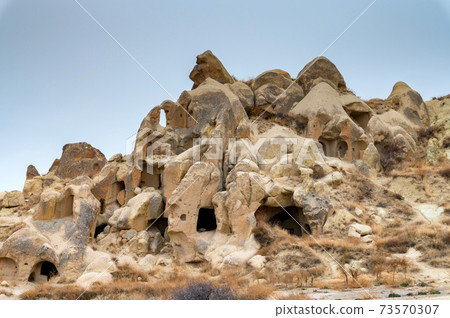 Landscape view of Uchisar, Cappadocia, Turkey under cloudy sky 73570307