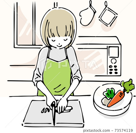 A woman cutting vegetables in the kitchen A woman cutting vegetables in the kitchen 73574119