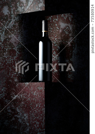 Unopened bottle of red wine on a background of old wall. Unopened bottle of red wine on a background of old wall. 73580914
