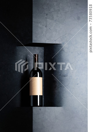 Bottle of red wine with old empty label. Bottle of red wine with old empty label. 73580918