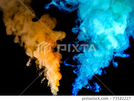colorful smoke on dark background 73582227