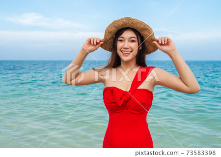 happy woman in sea beach at Koh MunNork Island, Rayong, Thailand happy woman in sea beach at Koh MunNork Island, Rayong, Thailand 73583398