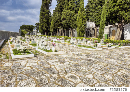 Crypts and details of the family tombs on the old city cemetery Cemiterio dos Prazeres in Lisbon, Portugal Crypts and details of the family tombs on the old city cemetery Cemiterio dos Prazeres in Lisbon, Portugal 73585376