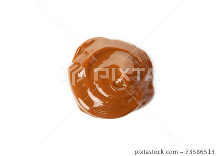 Caramel condensed milk isolated on white background 73586513