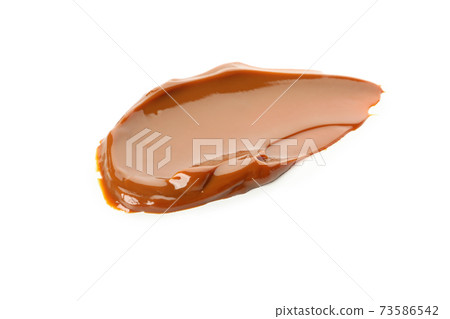 Caramel condensed milk isolated on white background 73586542
