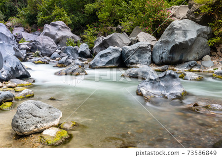 Long exposure image of Alcantara gorge in Sicily, Italy Long exposure image of Alcantara gorge in Sicily, Italy 73586849
