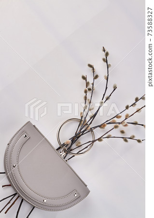 Elegant purple handbag with pussywillow branch. 73588327