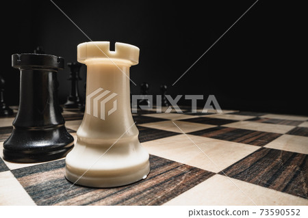 Chess figures on chess board macro photo 73590552