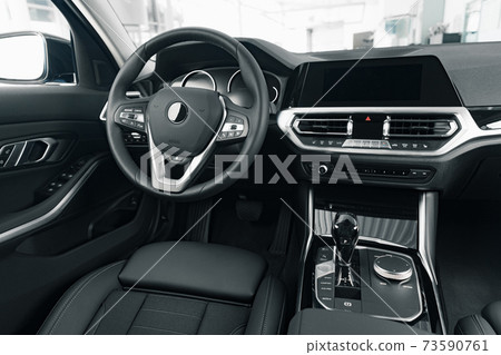 Steering wheel of a new luxury car Steering wheel of a new luxury car 73590761