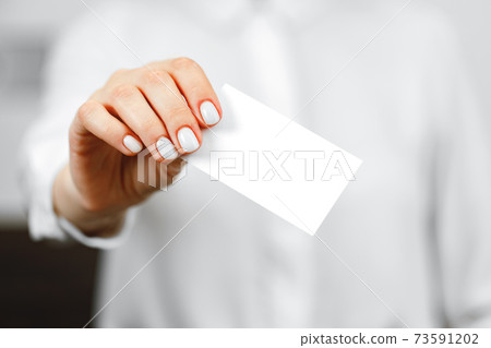 Close up of woman hotel receptionist giving you door key 73591202