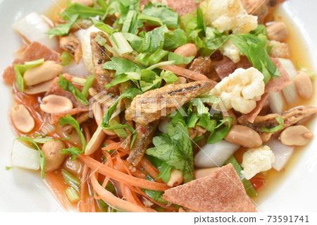 crispy fish with pork couple maw topping peanut in spicy and sour chili sauce salad on plate crispy fish with pork couple maw topping peanut in spicy and sour chili sauce salad on plate 73591741