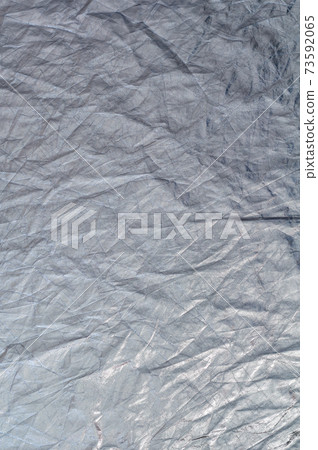 Texture silvery fabric reflector, simple crumpled background Texture silvery fabric reflector, simple crumpled background 73592065