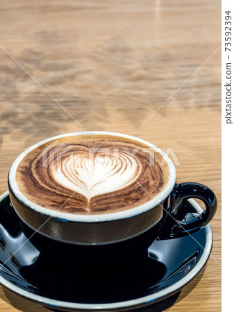 Black Coffee cup on wood table Black Coffee cup on wood table 73592394