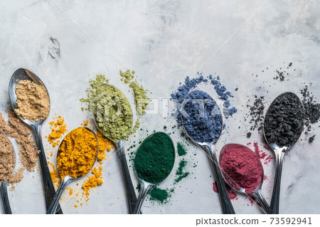 Super powders in spoons - matcha, turmeric, ginger, cocoa, spirulina, chia, cinnamon, black sesame 73592941