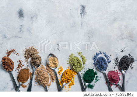 Super powders in spoons - matcha, turmeric, ginger, cocoa, spirulina, chia, cinnamon, black sesame Super powders in spoons - matcha, turmeric, ginger, cocoa, spirulina, chia, cinnamon, black sesame 73592942