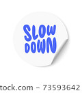 White sticker with Slow Down text. Hand lettering. Design for greeting cards, invitations, banners, gifts, prints and posters 73593642