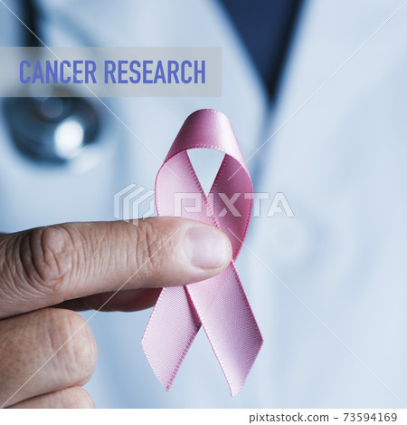 doctor with a pink ribbon and text cancer research 73594169