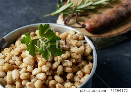 sausage and fried white beans typical of catalonia 73594172