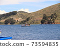 Bus crossing Lake Titicaca on a raft 73594835