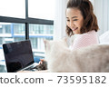 Business woman working from home with cat  73595182