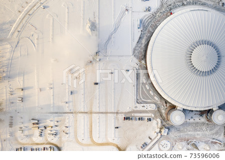 Top view in winter of a modern sports complex with parking in Minsk. Belarus 73596006