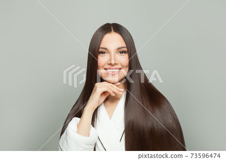 Healthy woman with long straight hair on white background Healthy woman with long straight hair on white background 73596474