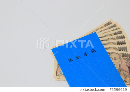 Pension handbook and 10,000 yen bill 73596619