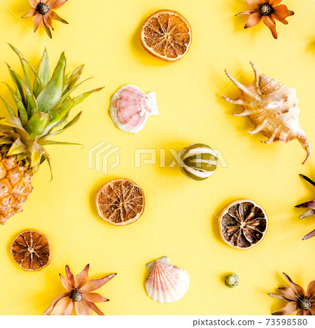 Tropical abstract background, pattern with pineapple on yellow background. Summer concept. Flat lay, top view. Tropical abstract background, pattern with pineapple on yellow background. Summer concept. Flat lay, top view. 73598580
