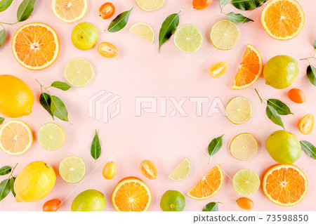 Frame made of summer tropical fruits: orange, lemon, lime, mango on pink background. Food concept. flat lay, top view 73598850
