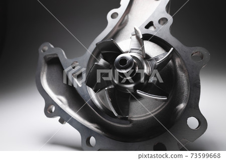 ICE liquid cooling pump. Engine coolant pump. Contrast light on gray background ICE liquid cooling pump. Engine coolant pump. Contrast light on gray background 73599668