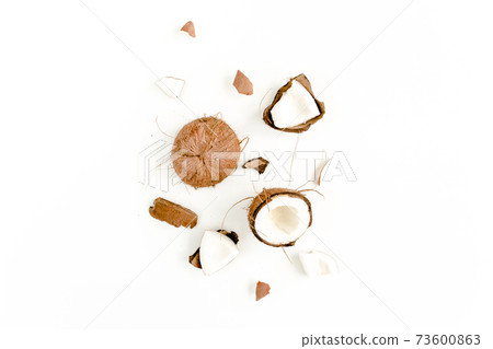 cracked coconut on white background. flat lat, top view 73600863