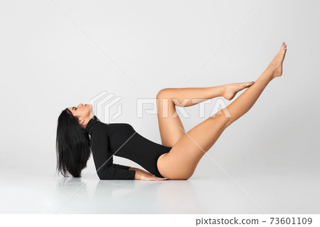 sporty girl posing on studio background. 73601109